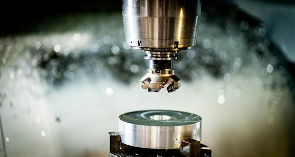 CNC machine cutting precision metal part