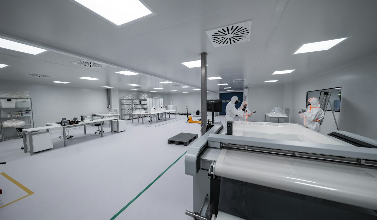 Workers in precision clean room facility