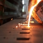 Iron molten metal pouring in sand mold ; green sand process Iron molten metal pouring in sand mold ; green sand process